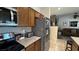 Well-equipped kitchen boasting stainless appliances, granite countertops, and a seamless transition to the adjacent living area at 4732 S Adriano Way, Pahrump, NV 89061