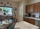 Bright kitchen featuring granite countertops, stainless steel dishwasher, and light-filled window with butterfly decals at 4732 S Adriano Way, Pahrump, NV 89061