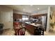 Inviting kitchen features granite countertops, stainless steel appliances, and a cozy breakfast nook with wicker chairs at 4732 S Adriano Way, Pahrump, NV 89061