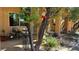 Shaded patio area with potted plants, fountain, and comfortable seating for outdoor relaxation at 4732 S Adriano Way, Pahrump, NV 89061