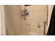 Clean shower with white tile, a shower curtain, and built in shelves at 4732 S Adriano Way, Pahrump, NV 89061