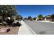 Scenic street view showcasing well-maintained homes and tree-lined sidewalks in a quiet neighborhood at 4732 S Adriano Way, Pahrump, NV 89061