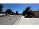 Quiet street view with well-maintained sidewalks and landscaping, offering a peaceful setting at 4732 S Adriano Way, Pahrump, NV 89061