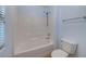 Bathroom featuring shower-tub combo and low-flow toilet at 4841 Raw Umber Ct, Las Vegas, NV 89131