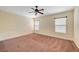 Spacious bedroom with ceiling fan and large windows at 4841 Raw Umber Ct, Las Vegas, NV 89131