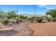 Scenic view of the community with desert landscaping, walking paths, and mountain views in the background at 4841 Raw Umber Ct, Las Vegas, NV 89131