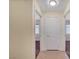 Hallway featuring tan tile flooring and view of bedrooms at 4841 Raw Umber Ct, Las Vegas, NV 89131