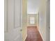 Hallway leading to bedroom with natural lighting and neutral color palette at 4841 Raw Umber Ct, Las Vegas, NV 89131