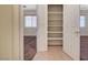 Hallway featuring a closet with shelves and view of bedroom at 4841 Raw Umber Ct, Las Vegas, NV 89131