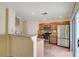 Bright kitchen showcases stainless steel appliances, wooden cabinetry, and a convenient breakfast bar at 4841 Raw Umber Ct, Las Vegas, NV 89131