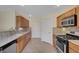 Well-appointed kitchen with granite counters, stainless appliances, and ample cabinet space for storage at 4841 Raw Umber Ct, Las Vegas, NV 89131
