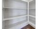 Pantry features open shelving, offering ample storage solutions for kitchen essentials and supplies at 4841 Raw Umber Ct, Las Vegas, NV 89131