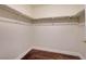 Empty walk-in closet with carpet and wall-mounted shelving at 4841 Raw Umber Ct, Las Vegas, NV 89131