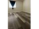 Bright bedroom featuring plank flooring and a window at 5000 Indian River Dr # 483, Las Vegas, NV 89103