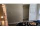 Bedroom with neutral walls, closet, and wood-look floors leading to the dining area at 5000 Indian River Dr # 483, Las Vegas, NV 89103
