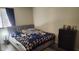Tranquil bedroom featuring a comfortable bed, modern flooring, and ample natural light at 5000 Indian River Dr # 483, Las Vegas, NV 89103