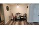 Cozy dining area featuring modern floors, contemporary light fixture, and dining table with chairs at 5000 Indian River Dr # 483, Las Vegas, NV 89103