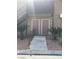 Condo entrance with two front doors, steps leading up, and desert landscaping with pebble ground covering at 5000 Indian River Dr # 483, Las Vegas, NV 89103