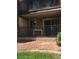 Charming front porch with brown rails and a small table at 5000 Indian River Dr # 483, Las Vegas, NV 89103