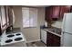 Charming kitchen with updated appliances, ample cabinet space, and a bright window at 5000 Indian River Dr # 483, Las Vegas, NV 89103
