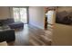 Bright living room with modern flooring, a sliding glass door to the patio, and comfortable seating at 5000 Indian River Dr # 483, Las Vegas, NV 89103