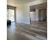 Open concept living room features plank flooring and access to the kitchen at 5000 Indian River Dr # 483, Las Vegas, NV 89103