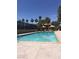 A well-maintained pool with palm trees creating a relaxing outdoor experience at 5000 Indian River Dr # 483, Las Vegas, NV 89103