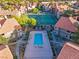 An aerial view of the community pool, tennis court, and lush landscaping at 5042 S Rainbow Blvd # 206, Las Vegas, NV 89118