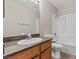 Bathroom featuring a vanity with sink, a toilet, and shower-tub combination at 5042 S Rainbow Blvd # 206, Las Vegas, NV 89118