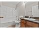 Bathroom with shower-tub combination, toilet, vanity, and mirror at 5042 S Rainbow Blvd # 206, Las Vegas, NV 89118