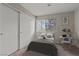 Comfortable bedroom featuring a large window, spacious closet, and a dedicated study area at 5042 S Rainbow Blvd # 206, Las Vegas, NV 89118