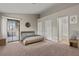 Relaxing bedroom with balcony access, and ensuite bathroom at 5042 S Rainbow Blvd # 206, Las Vegas, NV 89118