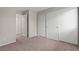 Neutral bedroom featuring a sliding door closet and plush carpeting at 5042 S Rainbow Blvd # 206, Las Vegas, NV 89118
