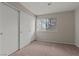 The bedroom features a double-door closet, window and neutral wall color, providing a serene retreat at 5042 S Rainbow Blvd # 206, Las Vegas, NV 89118
