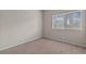 Neutral-toned bedroom showcasing natural light from a window at 5042 S Rainbow Blvd # 206, Las Vegas, NV 89118