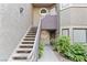 Exterior view of an entryway with a staircase leading to a condo unit at 5042 S Rainbow Blvd # 206, Las Vegas, NV 89118