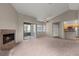 A bright living room features a fireplace, and a ceiling fan for added comfort at 5042 S Rainbow Blvd # 206, Las Vegas, NV 89118