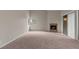 A bright living room features a fireplace, large windows, and a ceiling fan for added comfort at 5042 S Rainbow Blvd # 206, Las Vegas, NV 89118