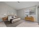 Serene main bedroom offering stylish bedside tables, a large window, and ample space at 5042 S Rainbow Blvd # 206, Las Vegas, NV 89118
