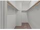 Small walk-in closet with shelving and carpeted floor at 5042 S Rainbow Blvd # 206, Las Vegas, NV 89118