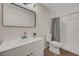 Well lit bathroom with updated vanity, new light fixture, and modern shower at 5161 Lindell Rd # 206, Las Vegas, NV 89118