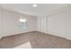 Bedroom with neutral carpet, natural light, and large sliding door closets at 5161 Lindell Rd # 206, Las Vegas, NV 89118