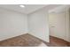 Cozy bedroom with neutral walls, plush carpeting, and a convenient closet for storage at 5161 Lindell Rd # 206, Las Vegas, NV 89118