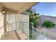 Exterior of a tan building with blue railings and a walkway at 5161 Lindell Rd # 206, Las Vegas, NV 89118