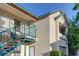 Exterior of a tan building with blue railings and a walkway at 5161 Lindell Rd # 206, Las Vegas, NV 89118