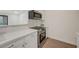 Modern kitchenette featuring sleek countertops, stainless steel oven, and black range at 5161 Lindell Rd # 206, Las Vegas, NV 89118