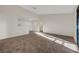 A well-lit living room with a large window and carpeted floors at 5161 Lindell Rd # 206, Las Vegas, NV 89118
