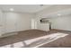 Living room with light from sliding glass doors and white walls leads to kitchen at 5161 Lindell Rd # 206, Las Vegas, NV 89118