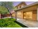 A well-maintained backyard featuring plush green grass and a covered patio, offering an ideal relaxation space at 5568 Table Top Ln, Las Vegas, NV 89135
