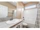 Bright bathroom featuring a single sink vanity with a white countertop, and a shower-tub combination at 5568 Table Top Ln, Las Vegas, NV 89135